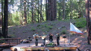 Fret & Fiddle on stage at at Enchanted Hills Camp with flag waving, Napa, CA